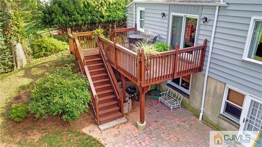 15 Carpender Road New Brunswick, NJ 08901 - Photo 23 of 25 a view of a roof deck with couches and wooden floor