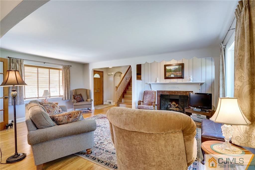 15 Carpender Road New Brunswick, NJ 08901 - Photo 6 of 25 a living room with furniture a fireplace and a large window