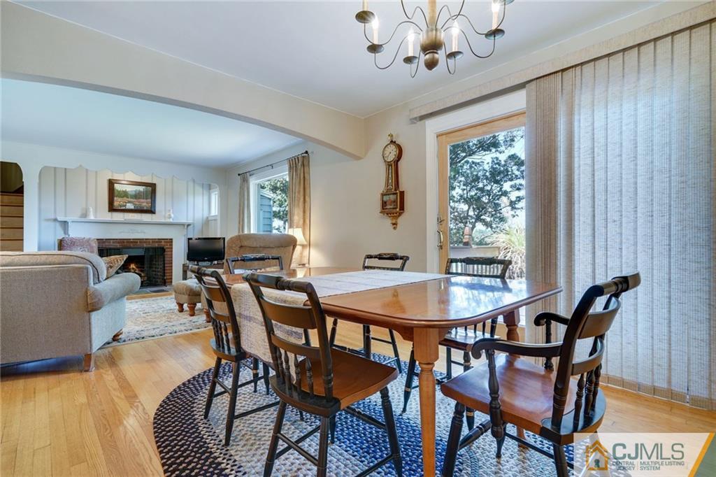 15 Carpender Road New Brunswick, NJ 08901 - Photo 9 of 25 a view of a dining room with furniture window and wooden floor