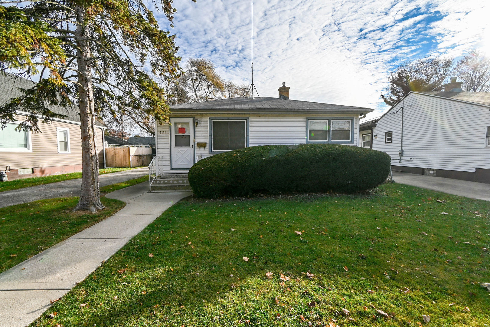 629 Fulton Avenue Waukegan, IL 60085 - Photo 1 of 25 a view of a house with a garden