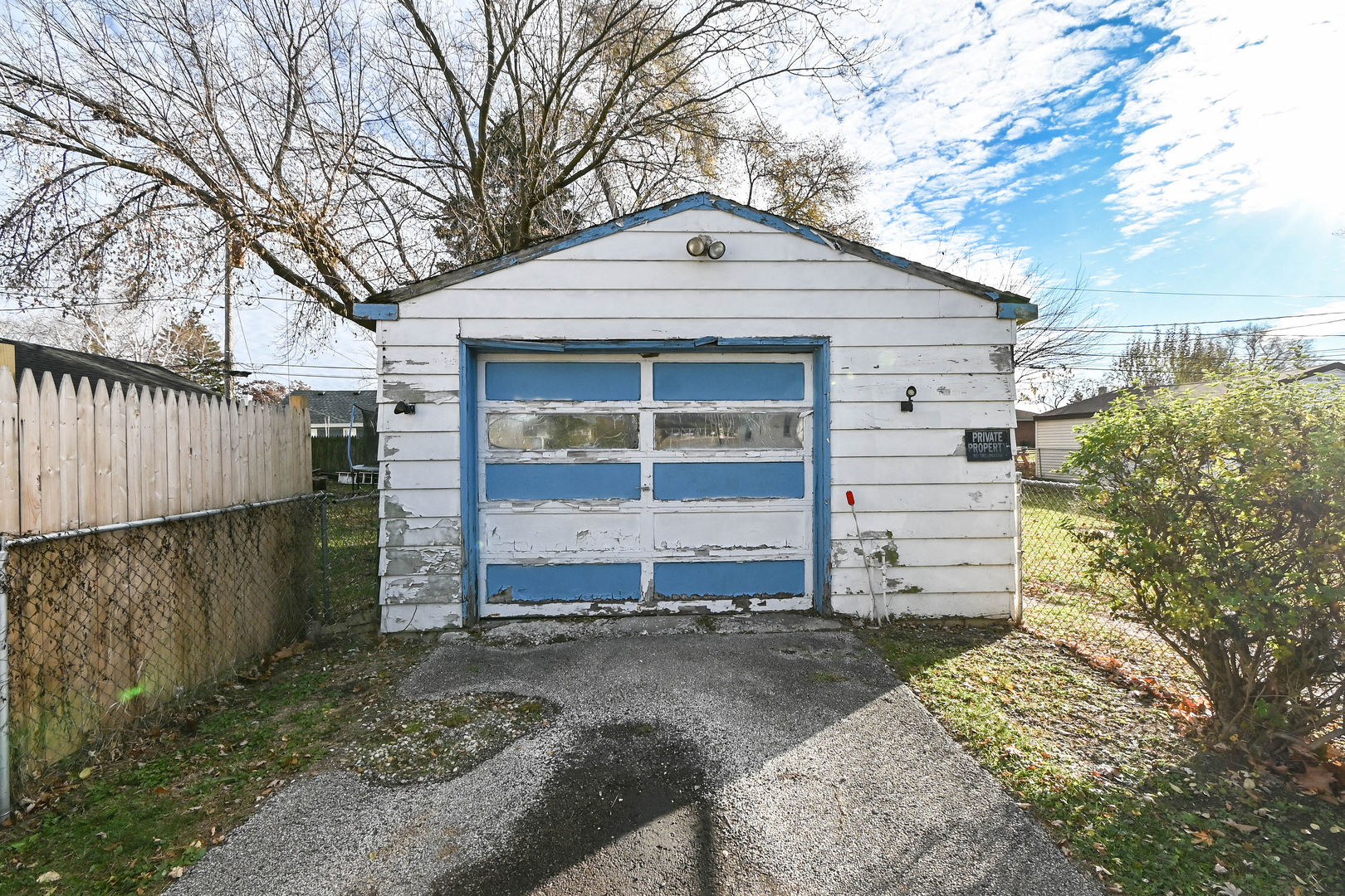 629 Fulton Avenue Waukegan, IL 60085 - Photo 23 of 25 a front view of a house with a yard and garage