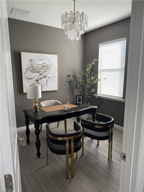 1657 Serena Avenue Naples, FL 34120 - Photo 12 of 40 a view of a dining room with furniture and window