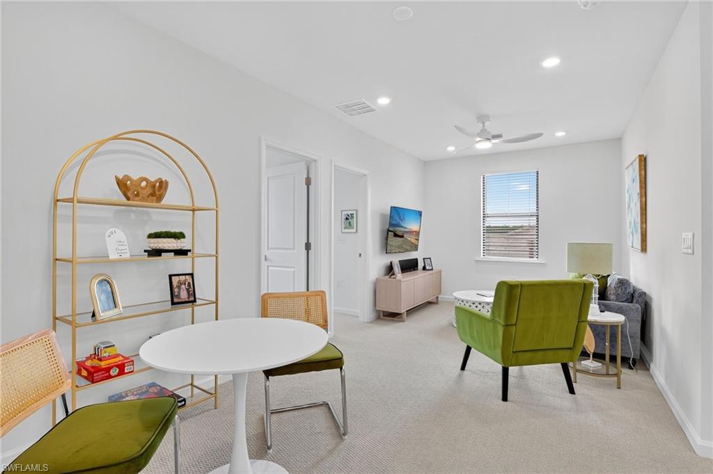 1657 Serena Avenue Naples, FL 34120 - Photo 16 of 40 a living room with furniture and a wooden floor