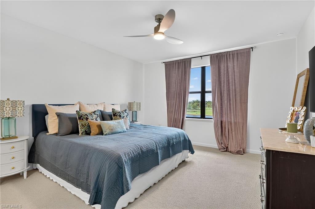 1657 Serena Avenue Naples, FL 34120 - Photo 18 of 40 a bedroom with a large bed and a window