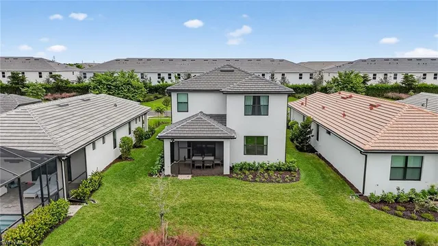 a aerial view of a house with a yard