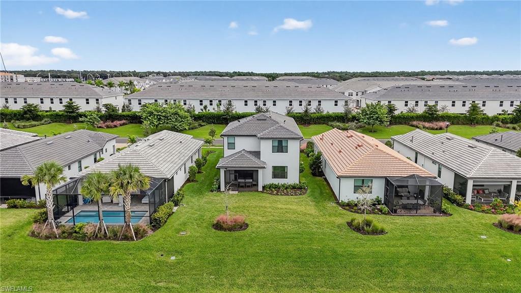 1657 Serena Avenue Naples, FL 34120 - Photo 30 of 40 an aerial view of a house with swimming pool and yard