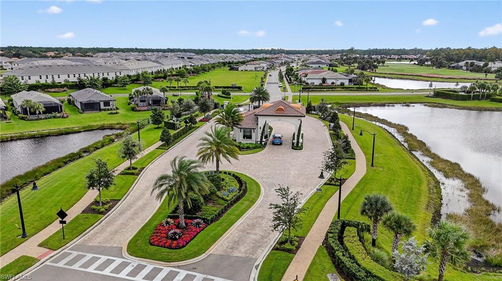1657 Serena Avenue Naples, FL 34120 - Photo 33 of 40 an aerial view of a golf course with swimming pool and outdoor seating