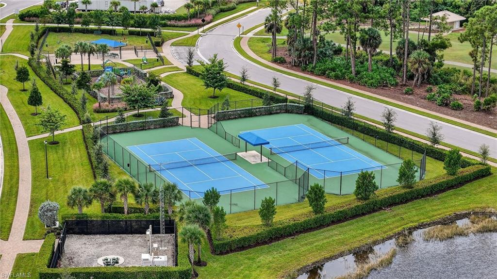 1657 Serena Avenue Naples, FL 34120 - Photo 35 of 40 an outdoor space with lots of green space and plants