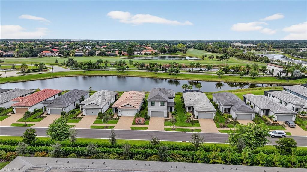 1657 Serena Avenue Naples, FL 34120 - Photo 37 of 40 an aerial view of a house with outdoor space lake view and mountain view in back