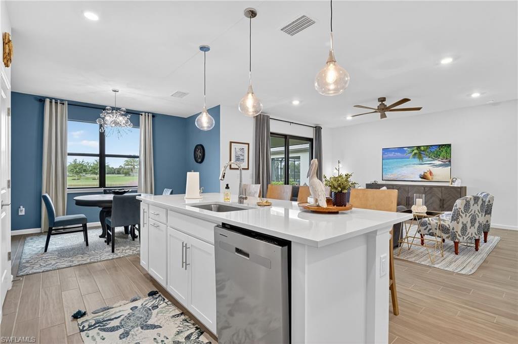 1657 Serena Avenue Naples, FL 34120 - Photo 8 of 40 a view of a kitchen and living room