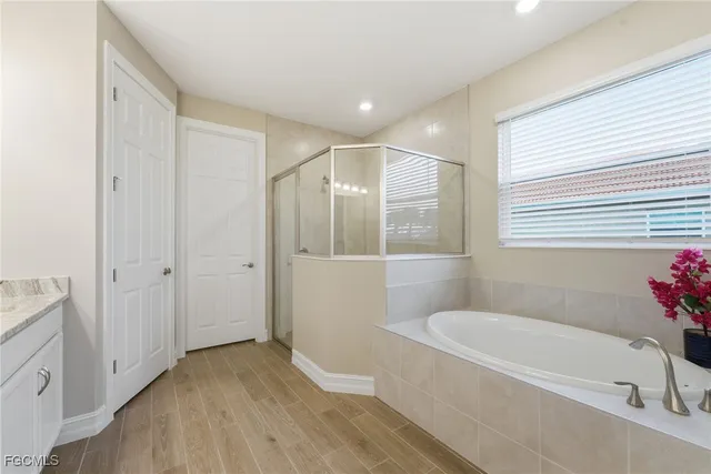 a bathroom with a tub and shower