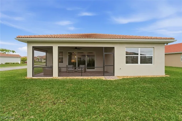 a view of a house with backyard porch and garden
