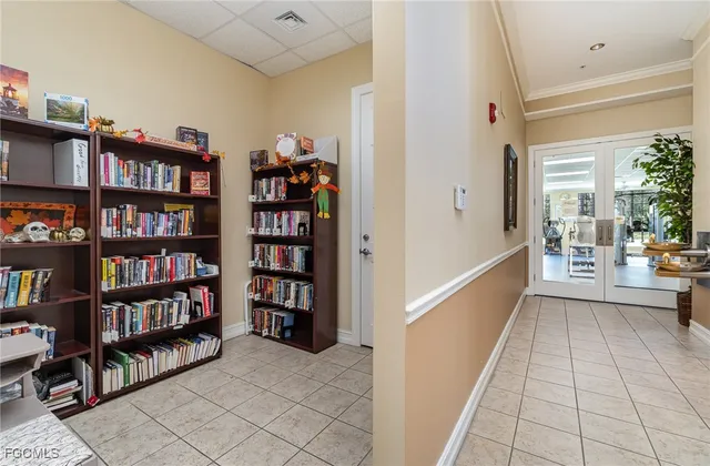 a room that has a bookshelf and a chair in it