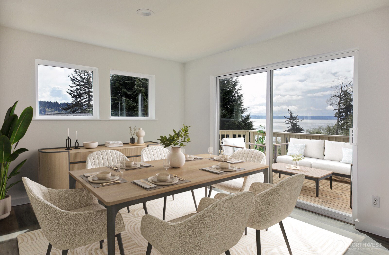 3760 Periwinkle Road Clinton, WA 98236 - Photo 14 of 34 a view of a dining room with furniture large windows and wooden floor