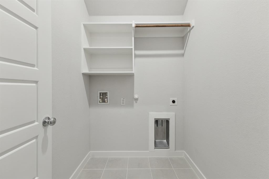 1947 Callington Way Forney, TX 75126 - Photo 15 of 21 Utility room in the Quartz home plan by Trophy Signature Homes – REPRESENTATIVE PHOTO