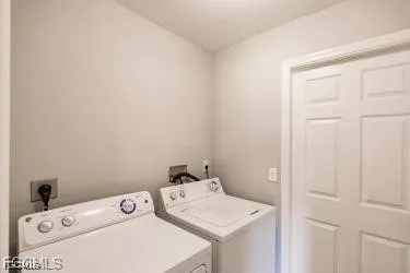 a view of a kitchen with a sink and microwave