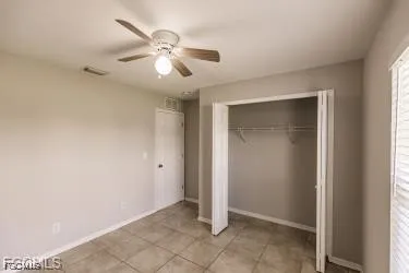 a view of a swimming pool with a bench and a yard