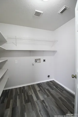 a view of small space with racks on the wall