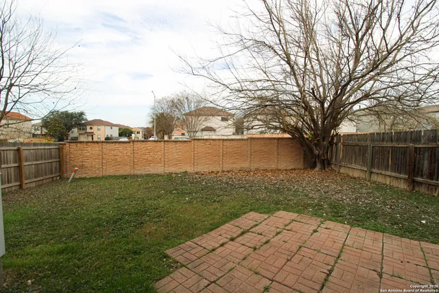 a view of backyard with green space