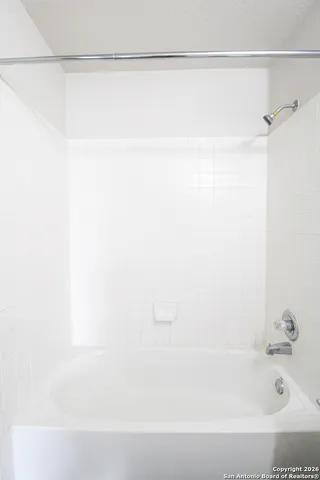 a bathroom with a bathtub