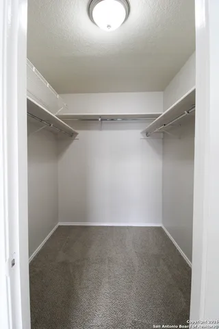 a view of a room with shelf on the wall