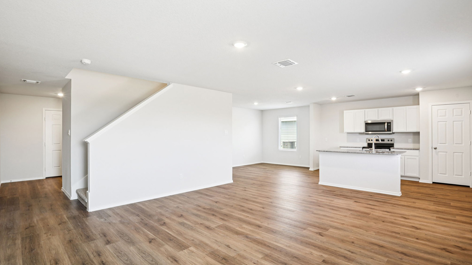 133 Wyatt Way Jarrell, TX 76537 - Photo 13 of 32 Open-concept living space with wood-finish flooring