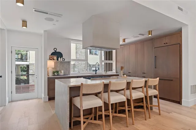 a kitchen with a sink stove and cabinets
