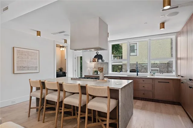 a stove top oven sitting inside of a kitchen
