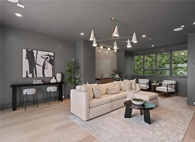 a bathroom with a granite countertop sink a mirror and a shower