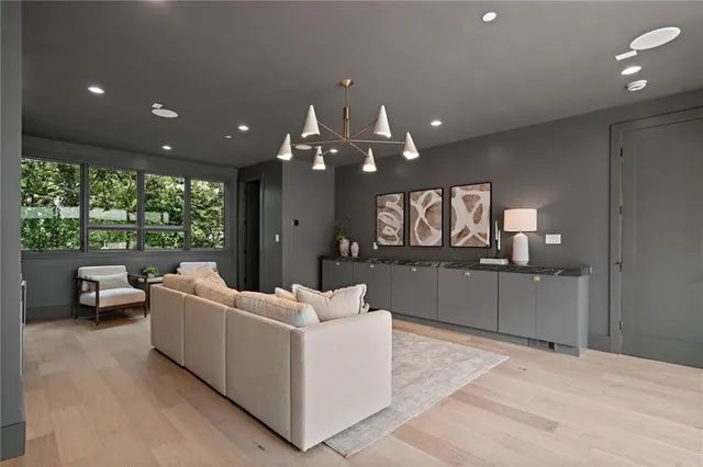 a view of a patio with table and chairs with wooden floor and fence
