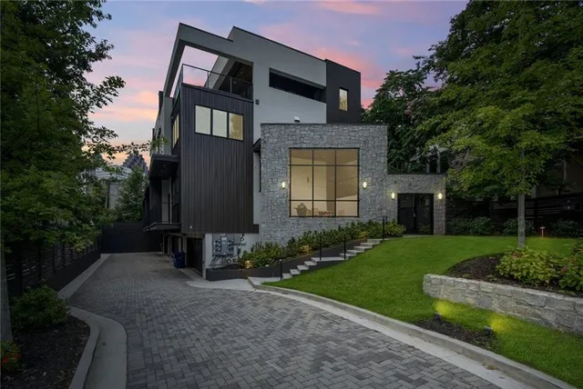 an aerial view of residential houses with outdoor space and street view