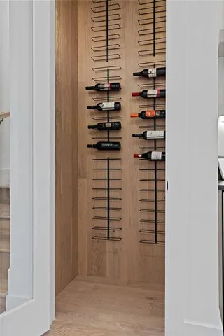 a living room with furniture a chandelier and a dining table