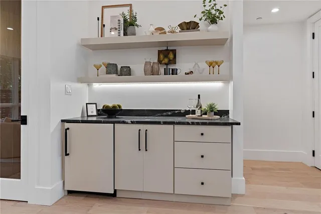 a very nice looking dining room with furniture