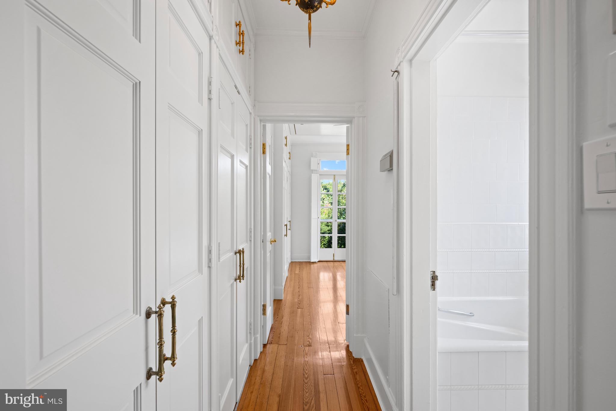 1423 34th Street Northwest Washington, DC 20007 - Photo 11 of 30 a view of a hallway with wooden floor and staircase