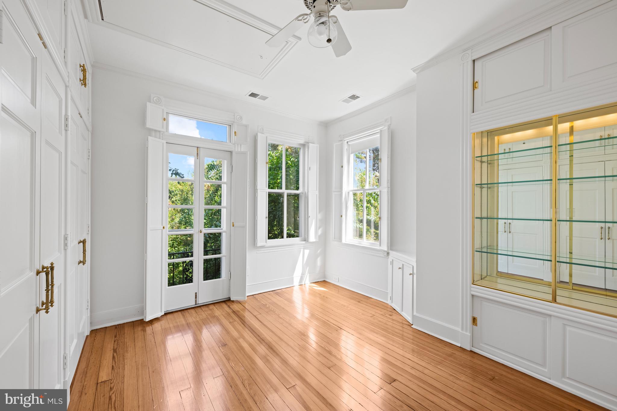 1423 34th Street Northwest Washington, DC 20007 - Photo 12 of 30 a view of a bedroom with wooden floor and windows