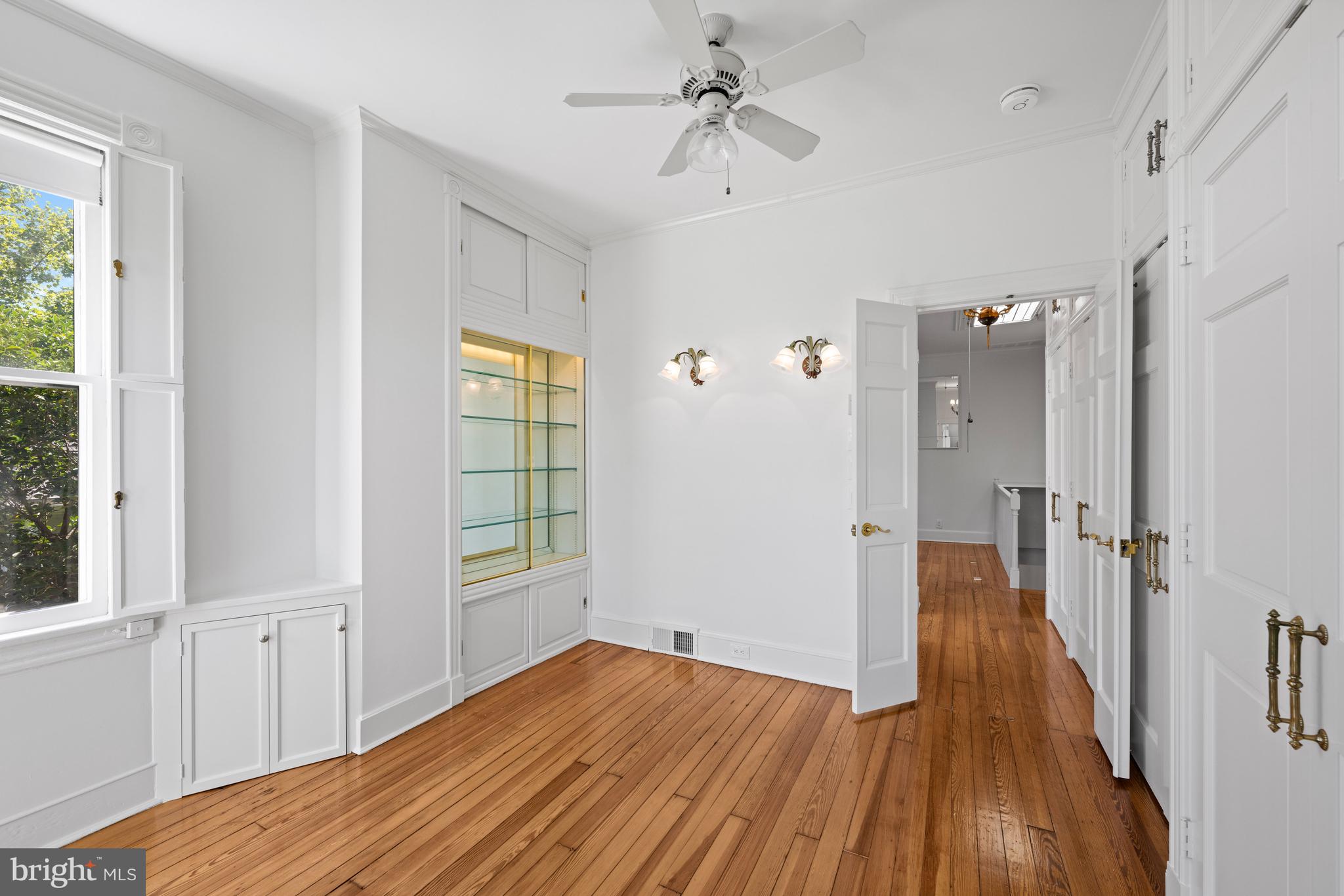 1423 34th Street Northwest Washington, DC 20007 - Photo 13 of 30 a view of a hallway with wooden floor and closet area
