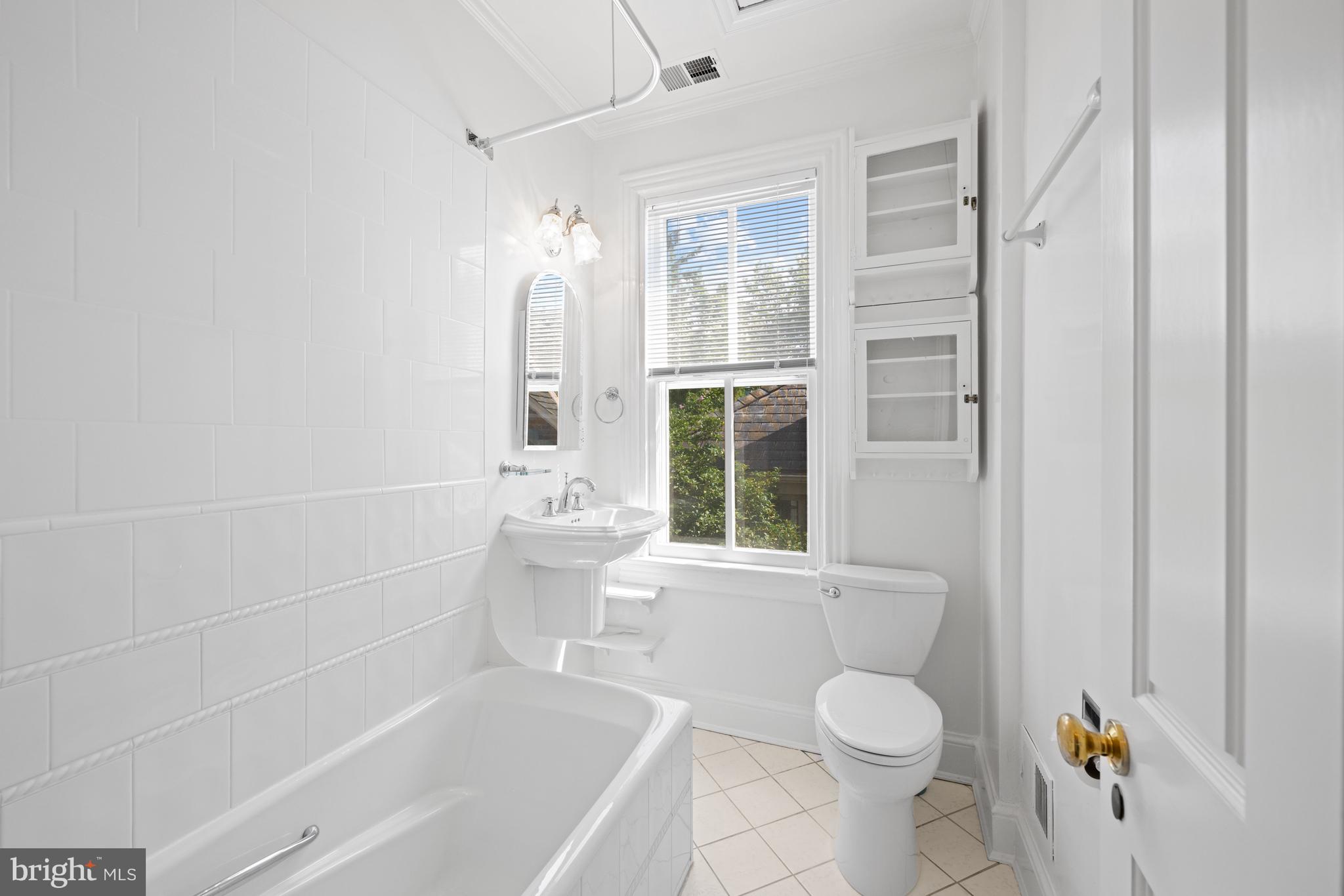 1423 34th Street Northwest Washington, DC 20007 - Photo 15 of 30 a bathroom with a toilet a sink and bathtub