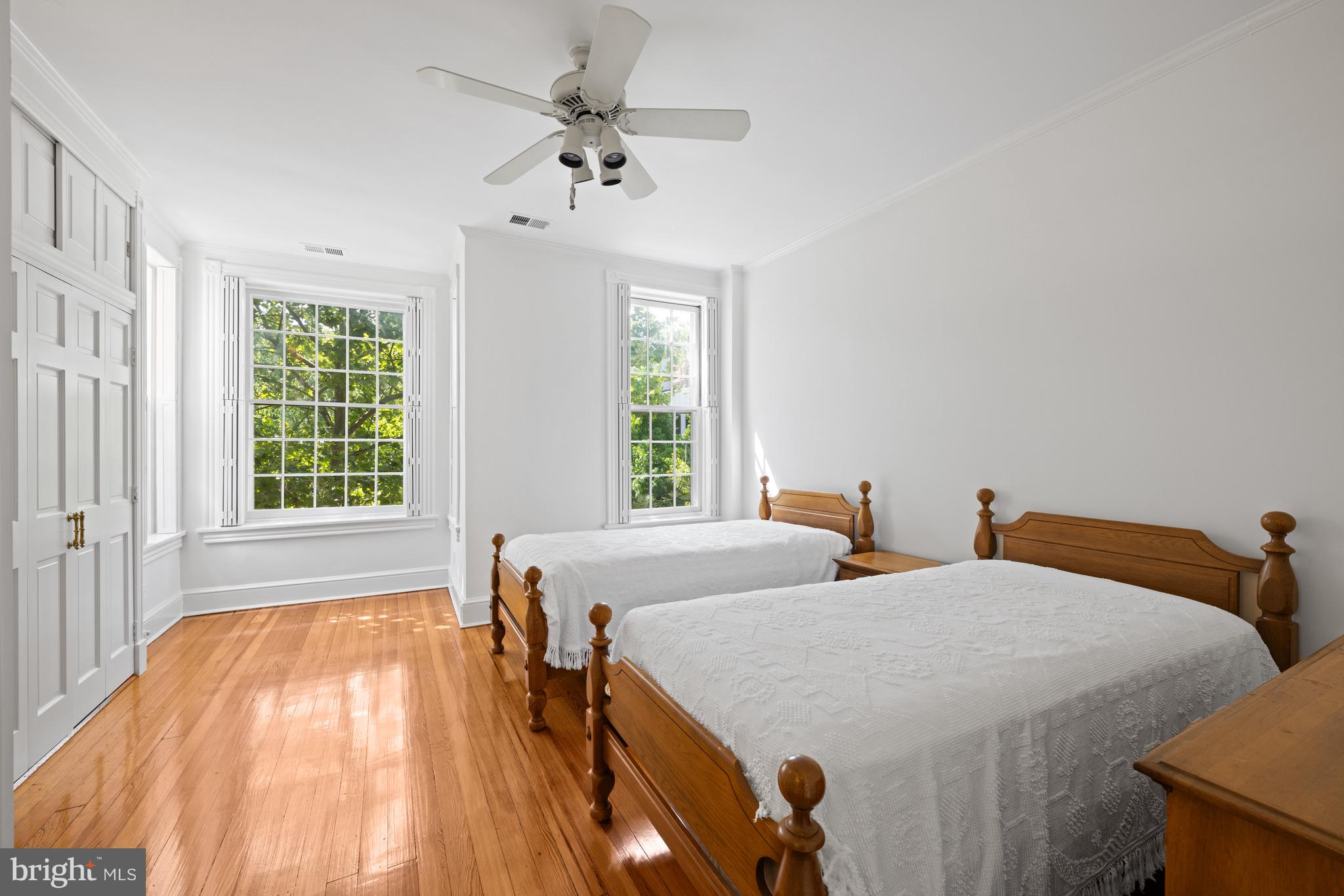 1423 34th Street Northwest Washington, DC 20007 - Photo 16 of 30 a bedroom with two beds and a window