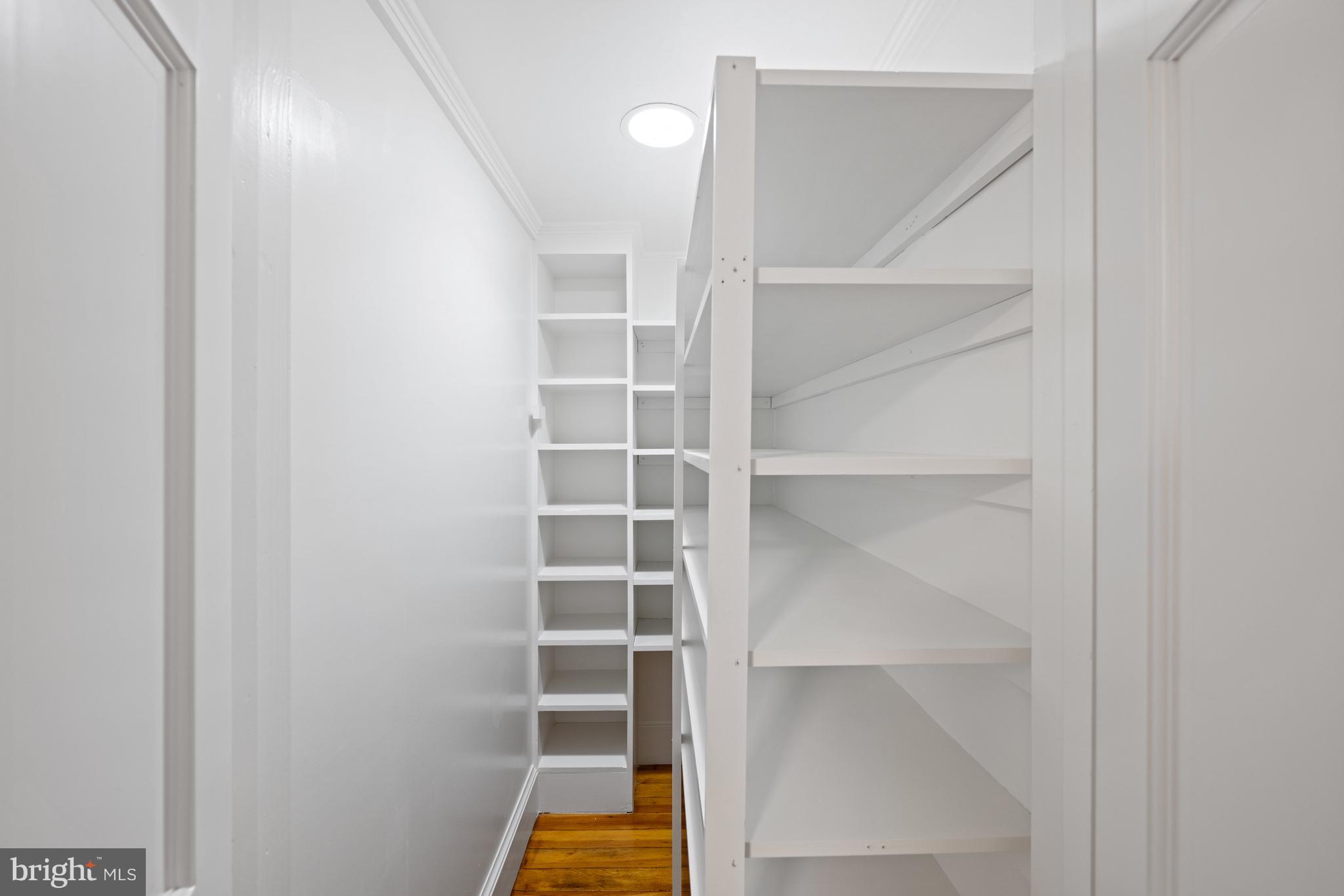 1423 34th Street Northwest Washington, DC 20007 - Photo 18 of 30 a view of walk in closet with empty racks