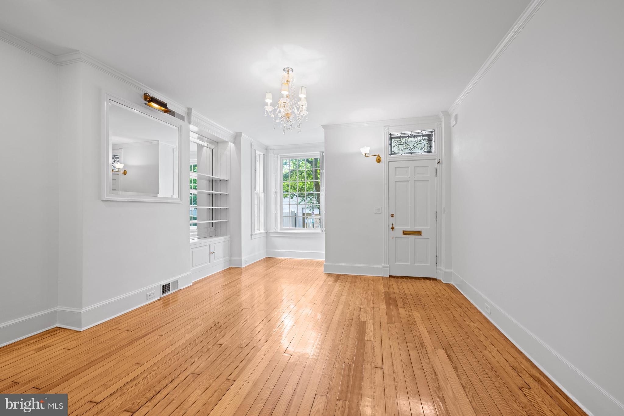 1423 34th Street Northwest Washington, DC 20007 - Photo 2 of 30 wooden floor in an empty room with a window