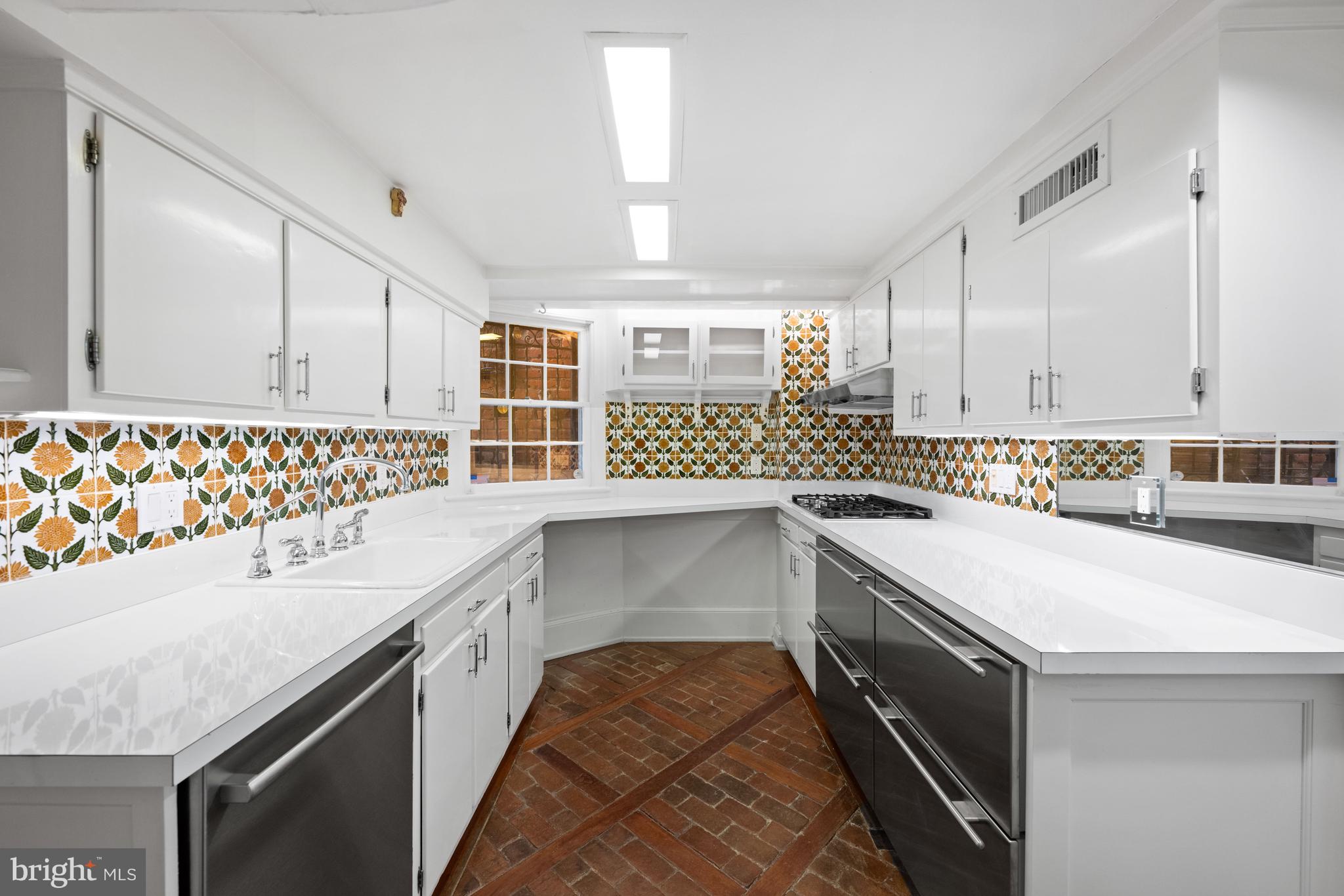 1423 34th Street Northwest Washington, DC 20007 - Photo 22 of 30 a kitchen with a sink and a stove