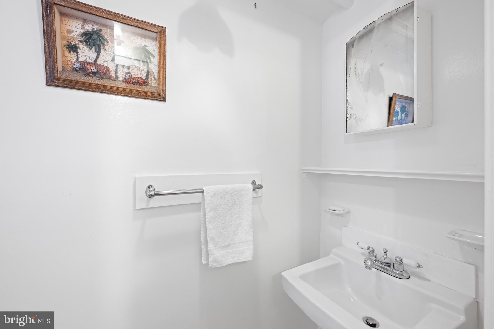1423 34th Street Northwest Washington, DC 20007 - Photo 25 of 30 a bathroom with a sink and a mirror