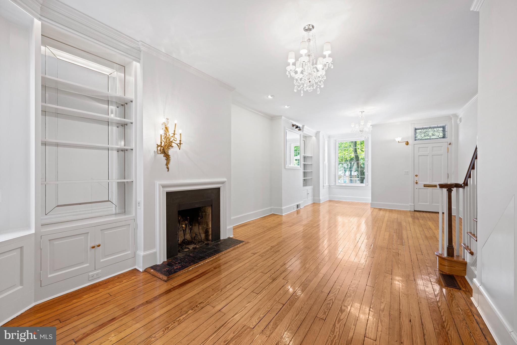 1423 34th Street Northwest Washington, DC 20007 - Photo 3 of 30 a view of a room with wooden floor fireplace and window