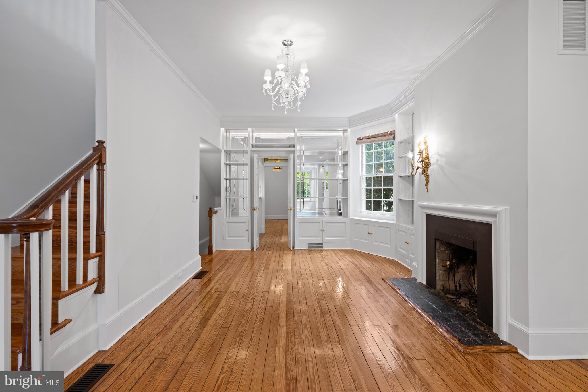 1423 34th Street Northwest Washington, DC 20007 - Photo 4 of 30 a view of a livingroom with wooden floor and a fireplace