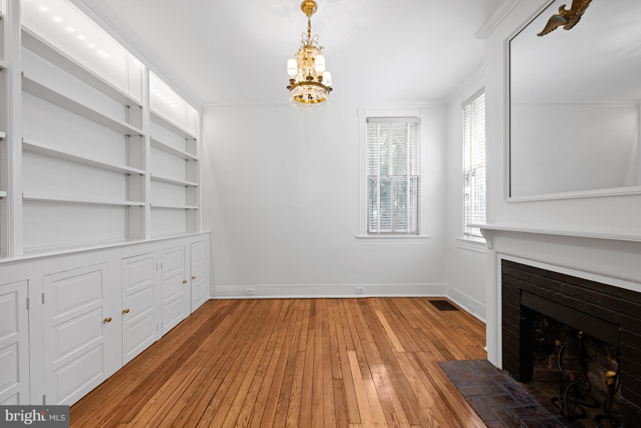 1423 34th Street Northwest Washington, DC 20007 - Photo 7 of 30 a view of empty room with wooden floor and fan