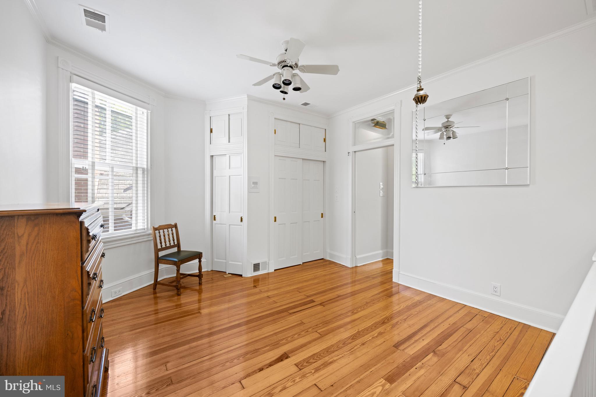 1423 34th Street Northwest Washington, DC 20007 - Photo 10 of 30 a view of empty room with wooden floor and fan