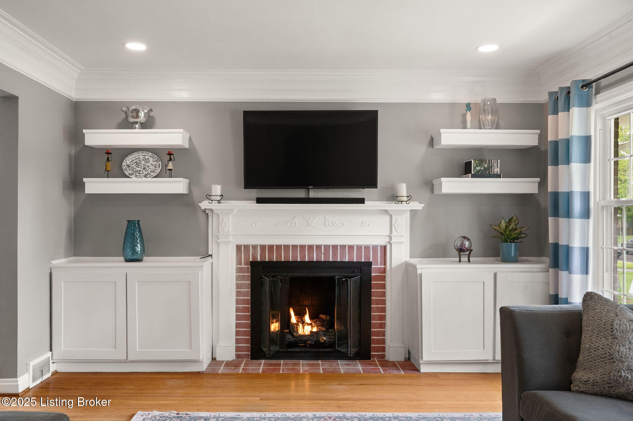 320 Biltmore Road Louisville, KY 40207 - Photo 5 of 43 Built-in shelves and cabinetry with gas burning fireplace