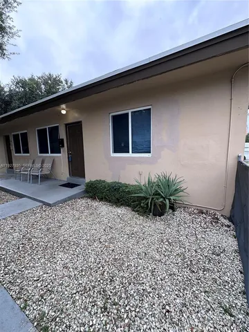 a house view with a backyard space