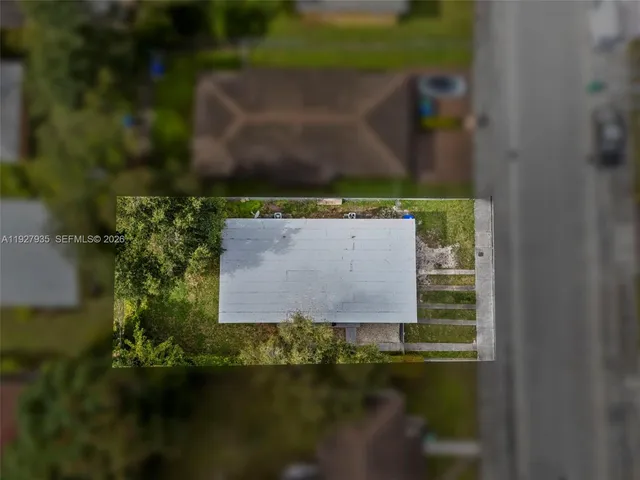 an aerial view of a house with lake view