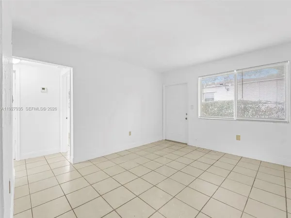 a view of an empty room and window